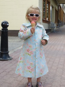 Ella models her latest thrift store find, while eating ice cream
